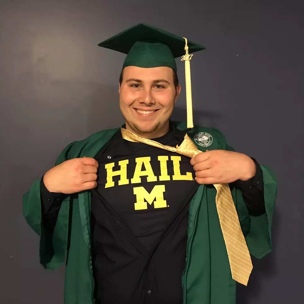 THE BLASPHEMY! MSU Graduate Reveals a Michigan Shirt Under Cap&Gown